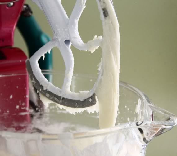 Cream cheese frosting on the blade of a stand mixer