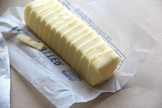 A stick of butter cut into slices