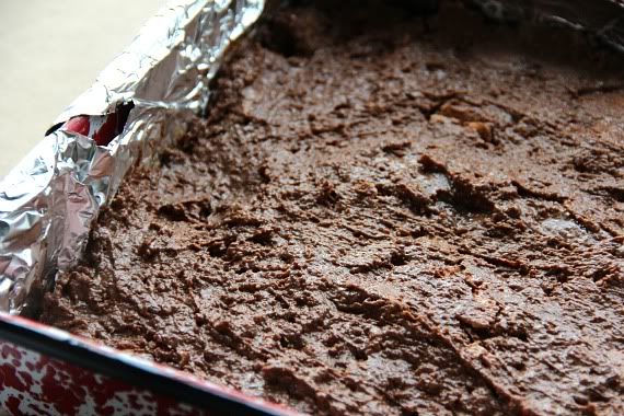 Chocolate mixture spread in a foil-lined pan