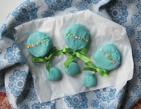 Teal frosted baby rattle cookies