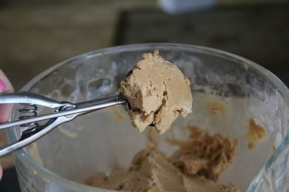 A cookie scoop full of peanut butter cookie dough