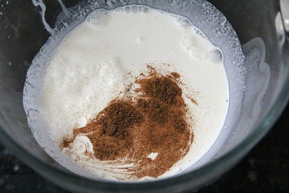 Top view of cream and spices in a mixing bowl