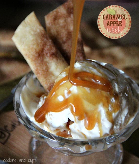 A dish of ice cream with caramel sauce and cinnamon pie crust garnishes