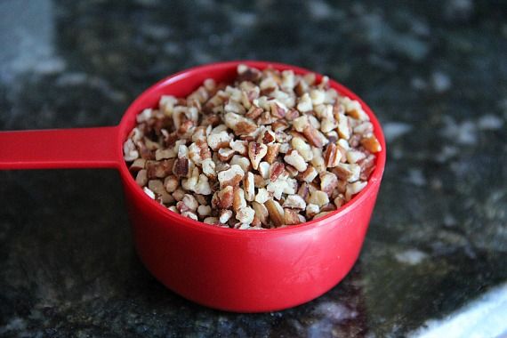 Chopped nuts in a measuring cup