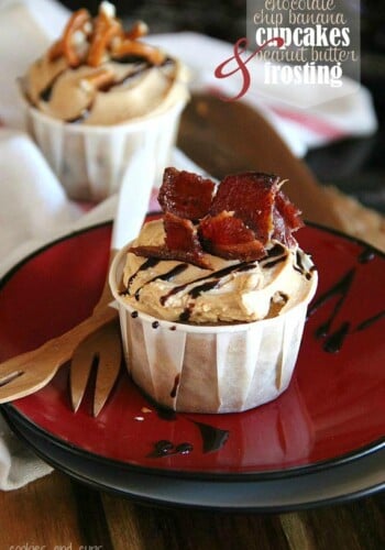A chocolate chip banana cupcake topped with peanut butter frosting and bacon pieces