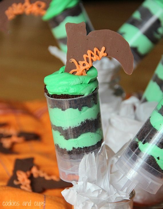 Green and black push pops with upside-down chocolate witch boots