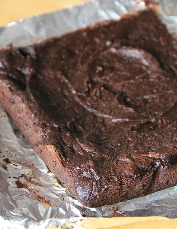 Top view of a pan of baked pumpkin brownies.