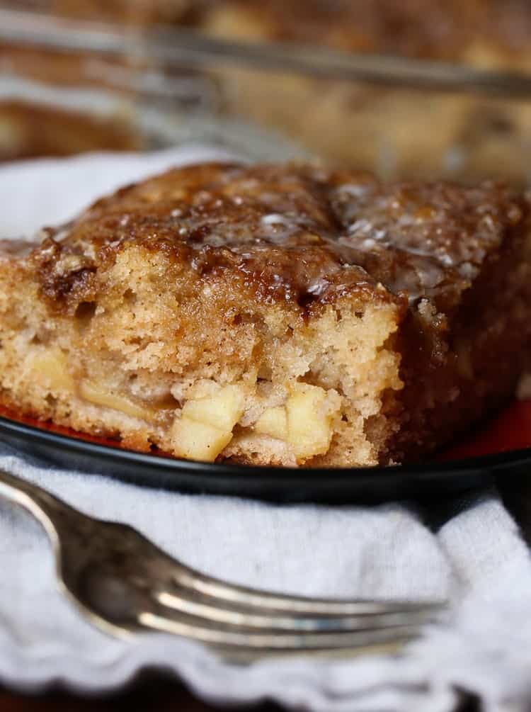 Slice of apple fritter cake with fork