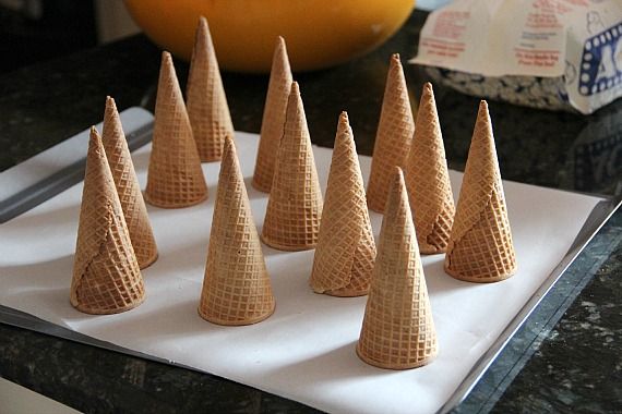 Upside down sugar cones on parchment paper