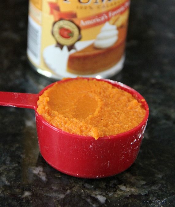 Pumpkin puree in a measuring cup