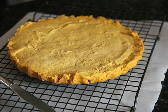 A round pumpkin shortbread on a cooling rack