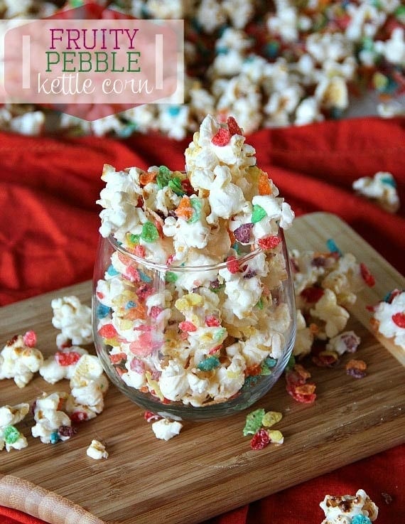 Fruity pebble kettle corn overflowing a clear glass