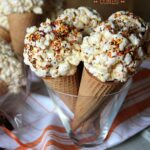 Popcorn ball ice cream cones in a clear cup