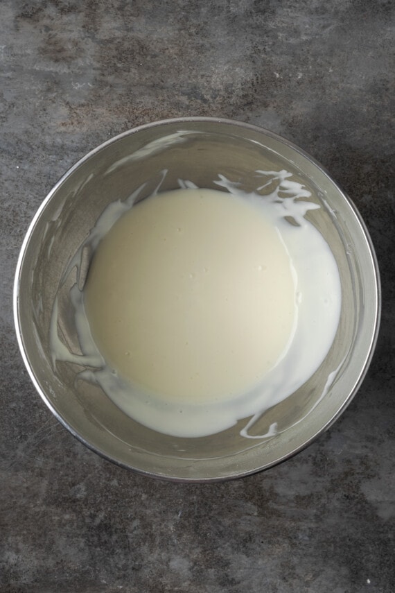 Sweet cream cheese filling in a metal mixing bowl.