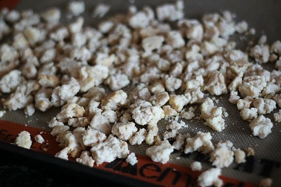 Baked shortbread streusel crumbles on a baking sheet