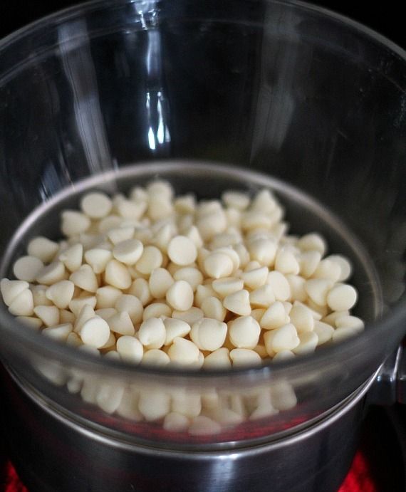 White chocolate chips in a glass mixing bowl