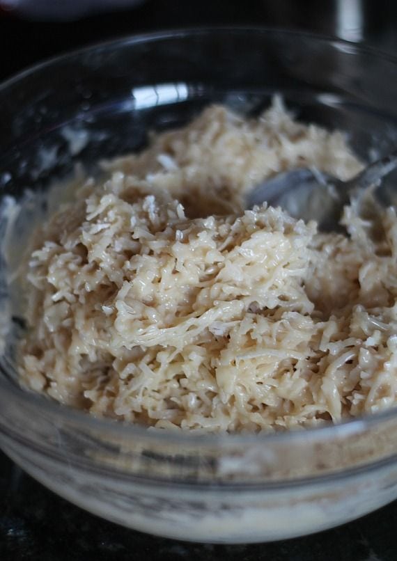 Shredded coconut macaroon batter in a mixing bowl