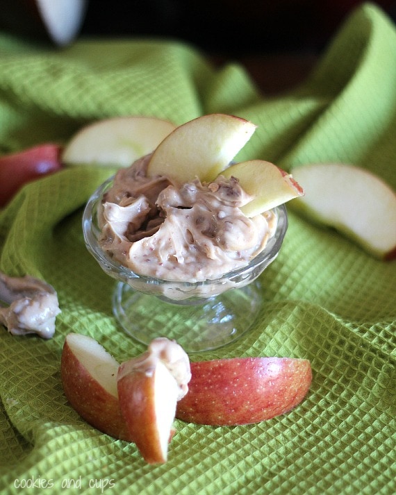 Caramel apple dip in a bowl with apple wedges