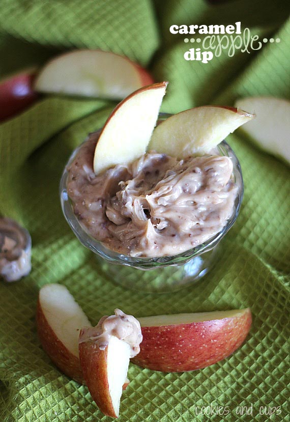 Overhead view of Caramel Apple Dip in a glass with two apple slices sticking out