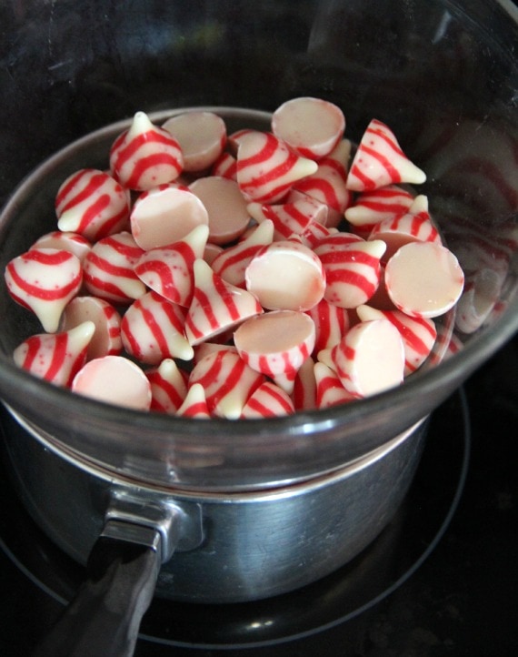 Unwrapped candy cane kisses candies in a bowl