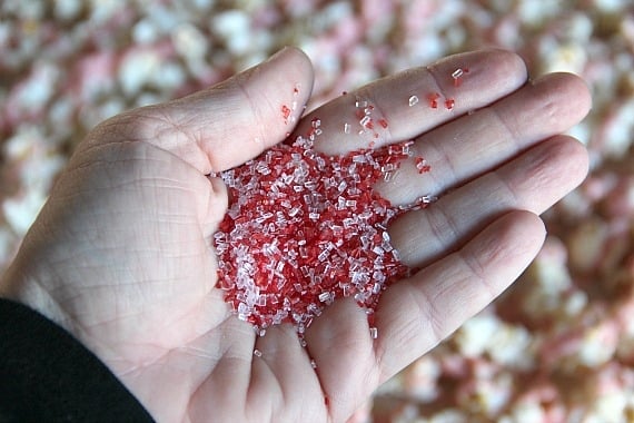 A handful of red and white sugar sprinkles