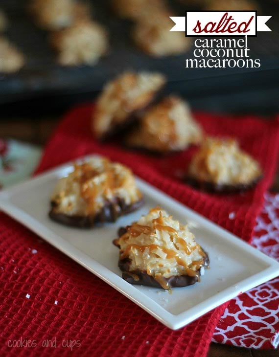 Two coconut macaroons drizzled with salted caramel on a white plate