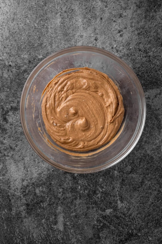 Gingerbread cupcake batter in a glass bowl.