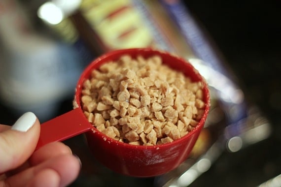 A measuring cup of toffee chips