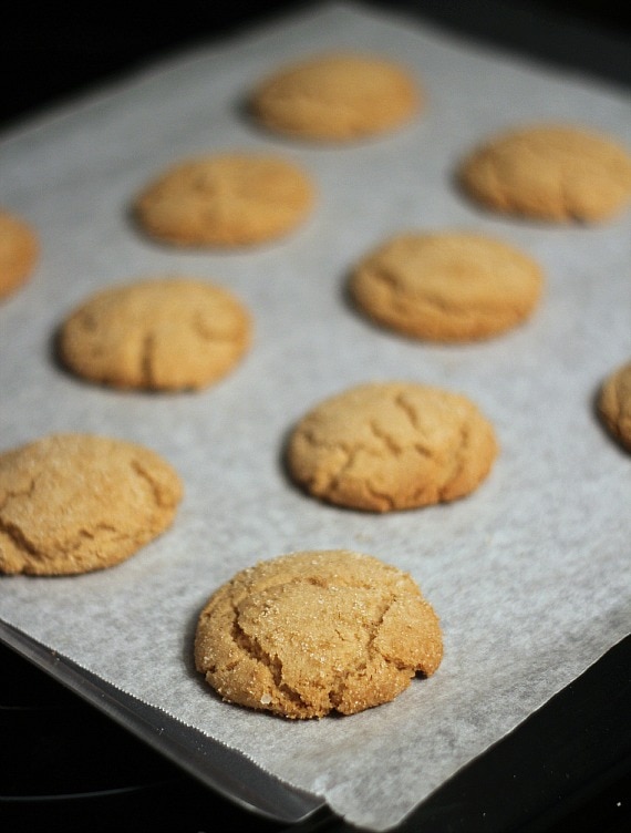 Brown sugar cookies on a parchment-lined baking sheet
