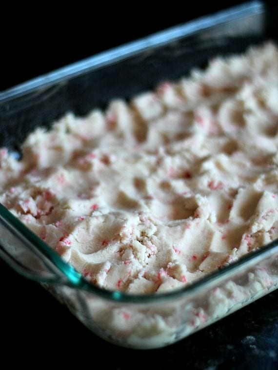 Peppermint sugar cookie dough pressed into a 9x13 baking dish