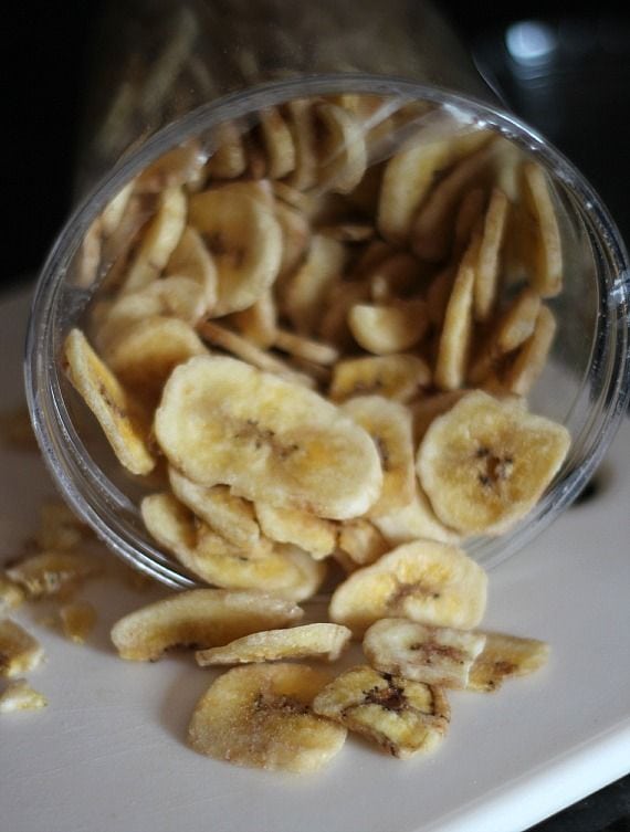 Top view of sliced banana chips in a jar