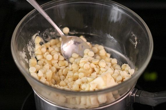 White chocolate chips and pureed banana in a double boiler bowl