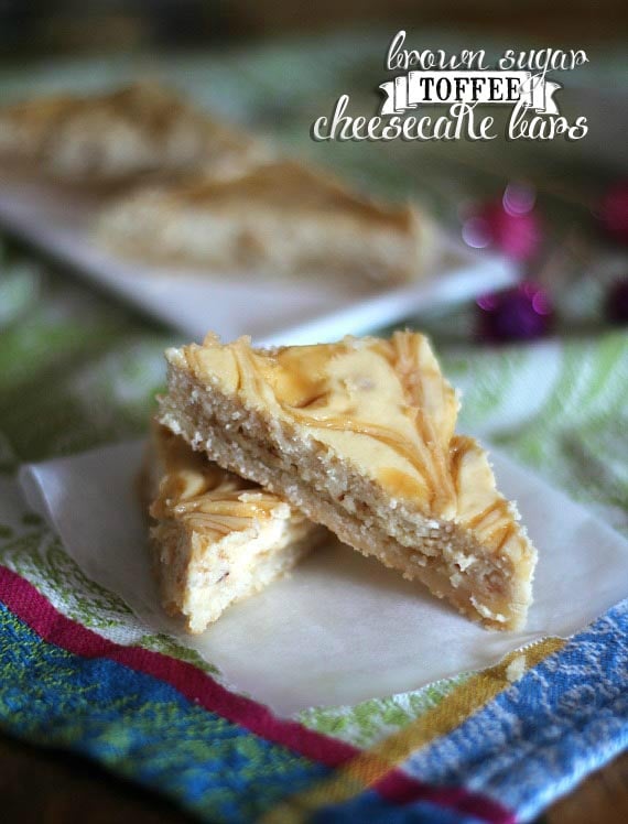 Close-up of two wedges of Brown Sugar Toffee cheesecake bars on a napkin