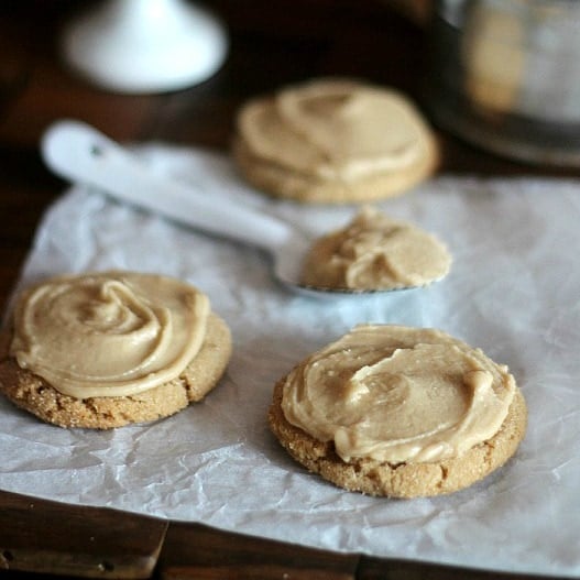 Brown sugar cookies iced with buttercream frosting.