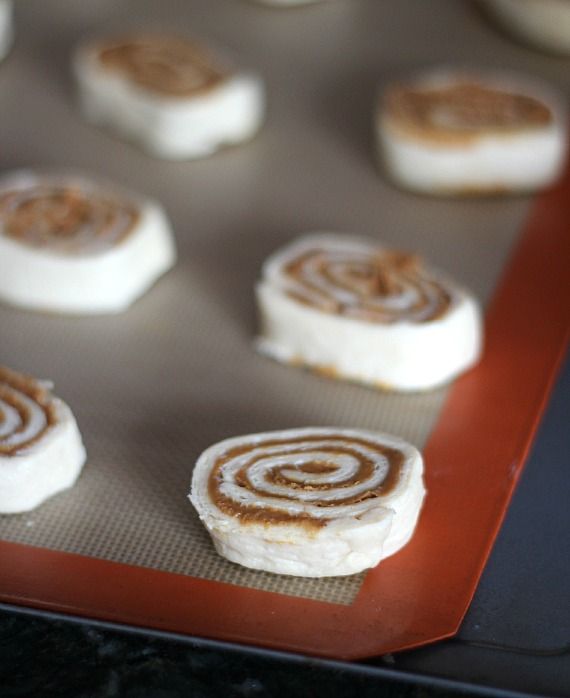 Slices of Biscoff Crescent Roll cookie dough on a baking mat