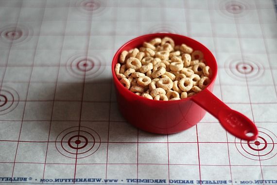 Cheerios in a red measuring cup