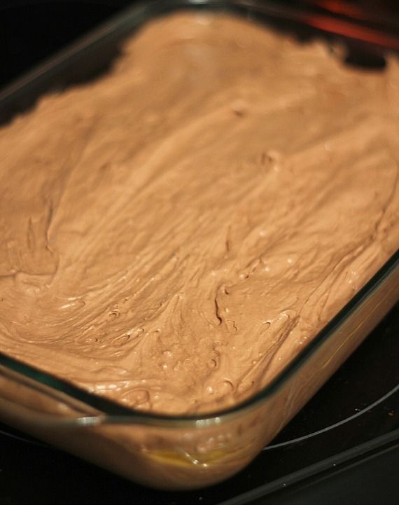 Peanut butter batter spread in a 9x13 pan