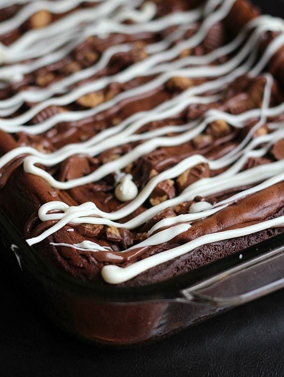 White icing drizzled over peanut butter cup coffee cake in a 9x13 pan