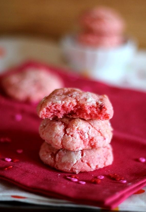 A stack of three pink strawberry cake mix cookies.