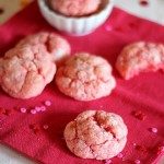 Strawberry cake mix cookies laid out on a pink napkin.