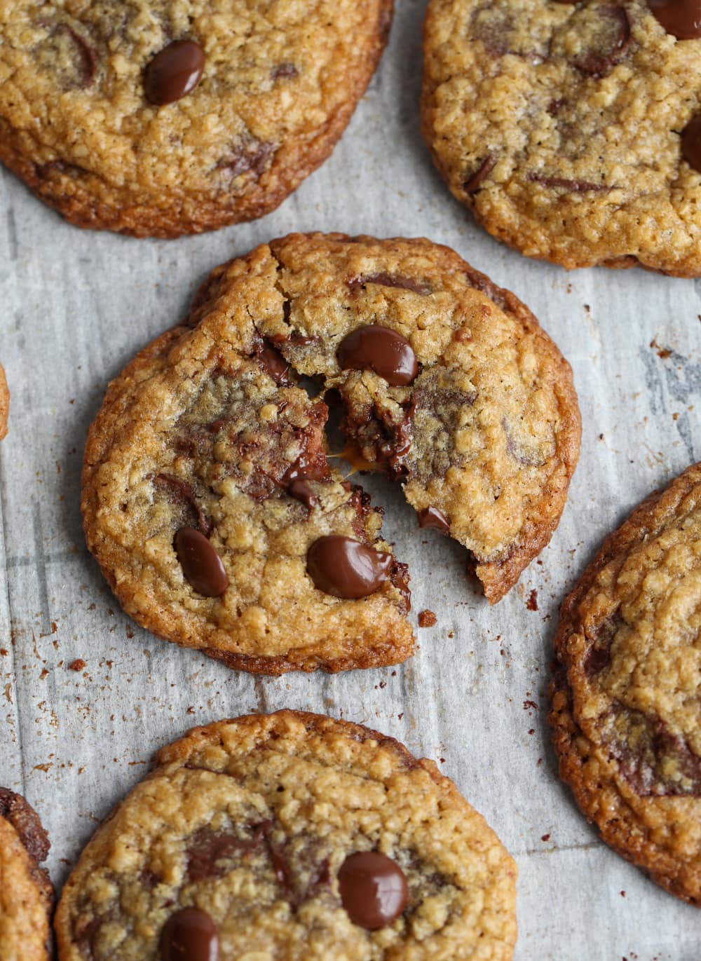 Carmelita Caramel Stuffed Cookie broken apart on a baking sheet