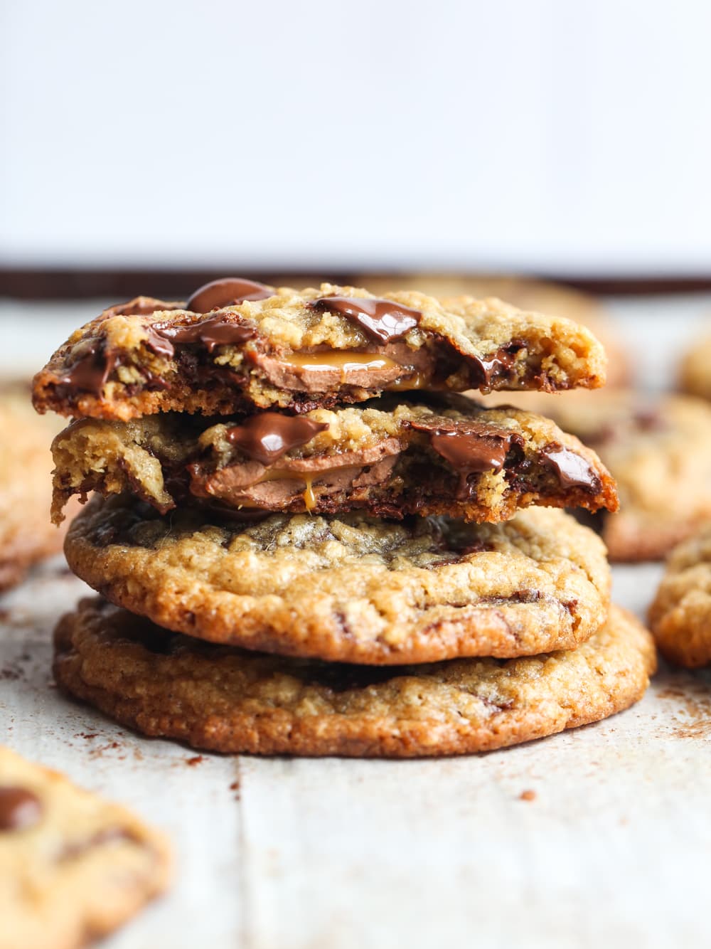 Caramel filled oatmeal chocolate chip cookies stacked