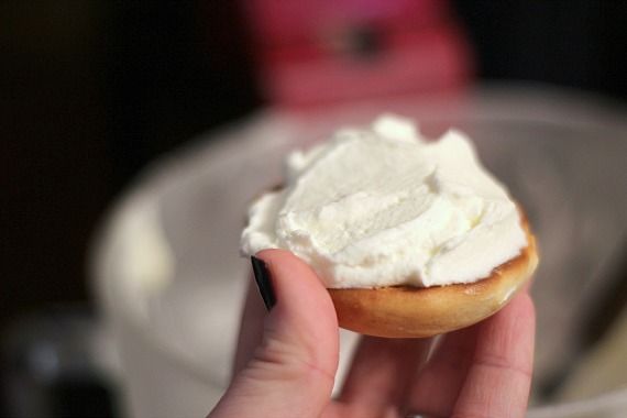 Half of a vanilla whoopie pie with whipped cream filling