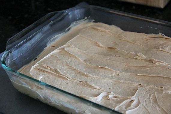 Peanut butter frosting mixture spread over crust in a 9x13 pan