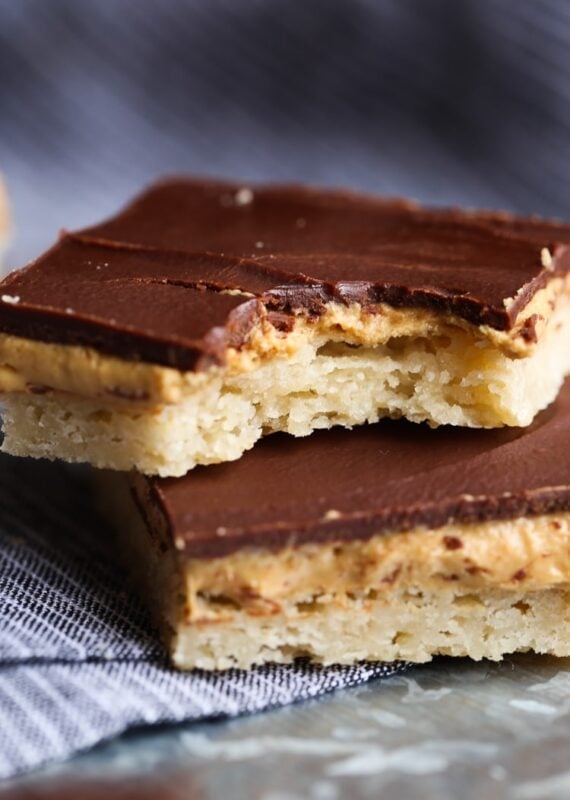Tagalong Bars are a homemade version of the classic Girl Scout Cookie...a buttery shortbread crust, with a sweet, creamy peanut butter filling, topped with rich chocolate. A fun twist on the original!