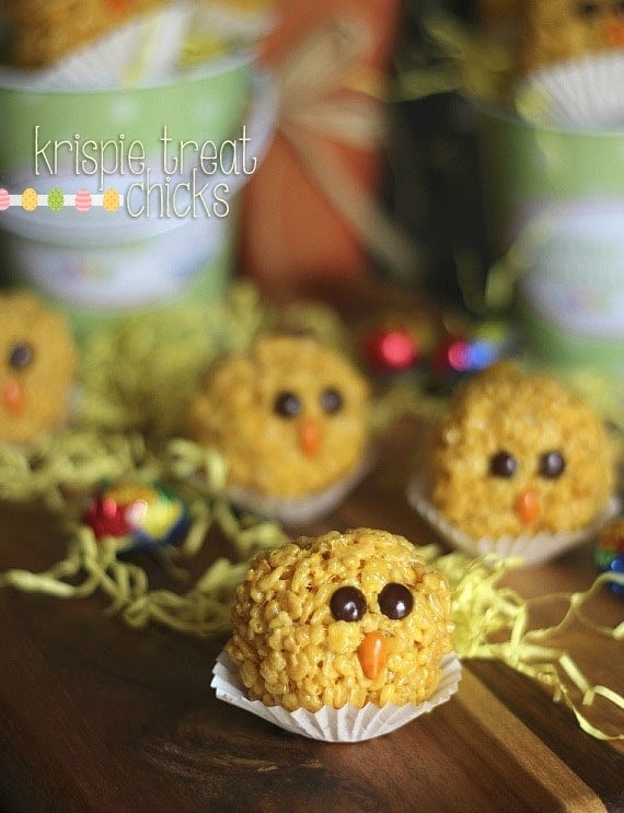 Krispie treat chicks on a wooden board