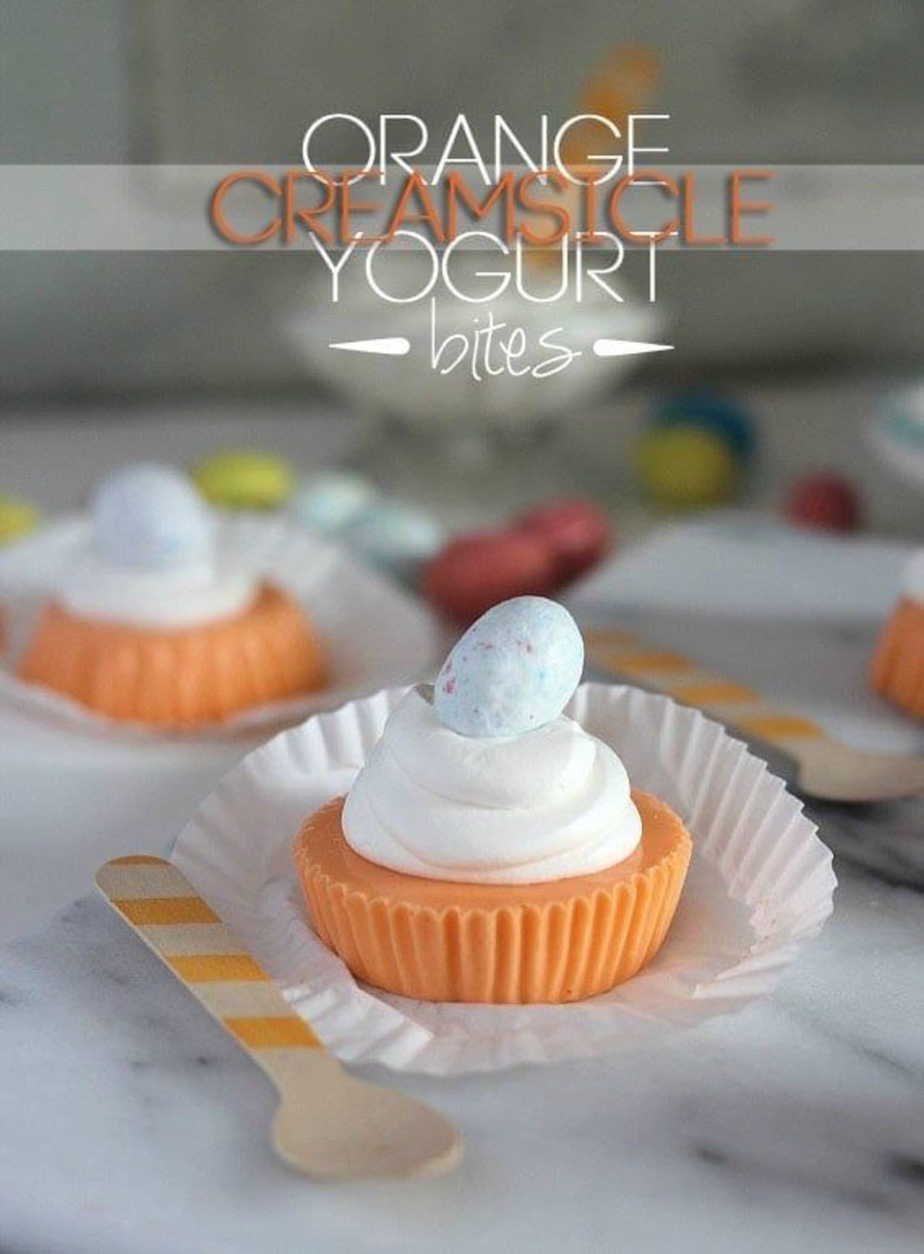 Creamsicle yogurt bites topped with whipped cream