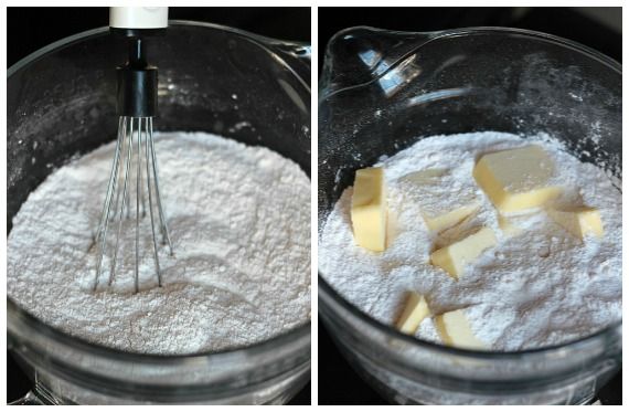 Boxed cake mix powder and chunks of butter in a mixing bowl