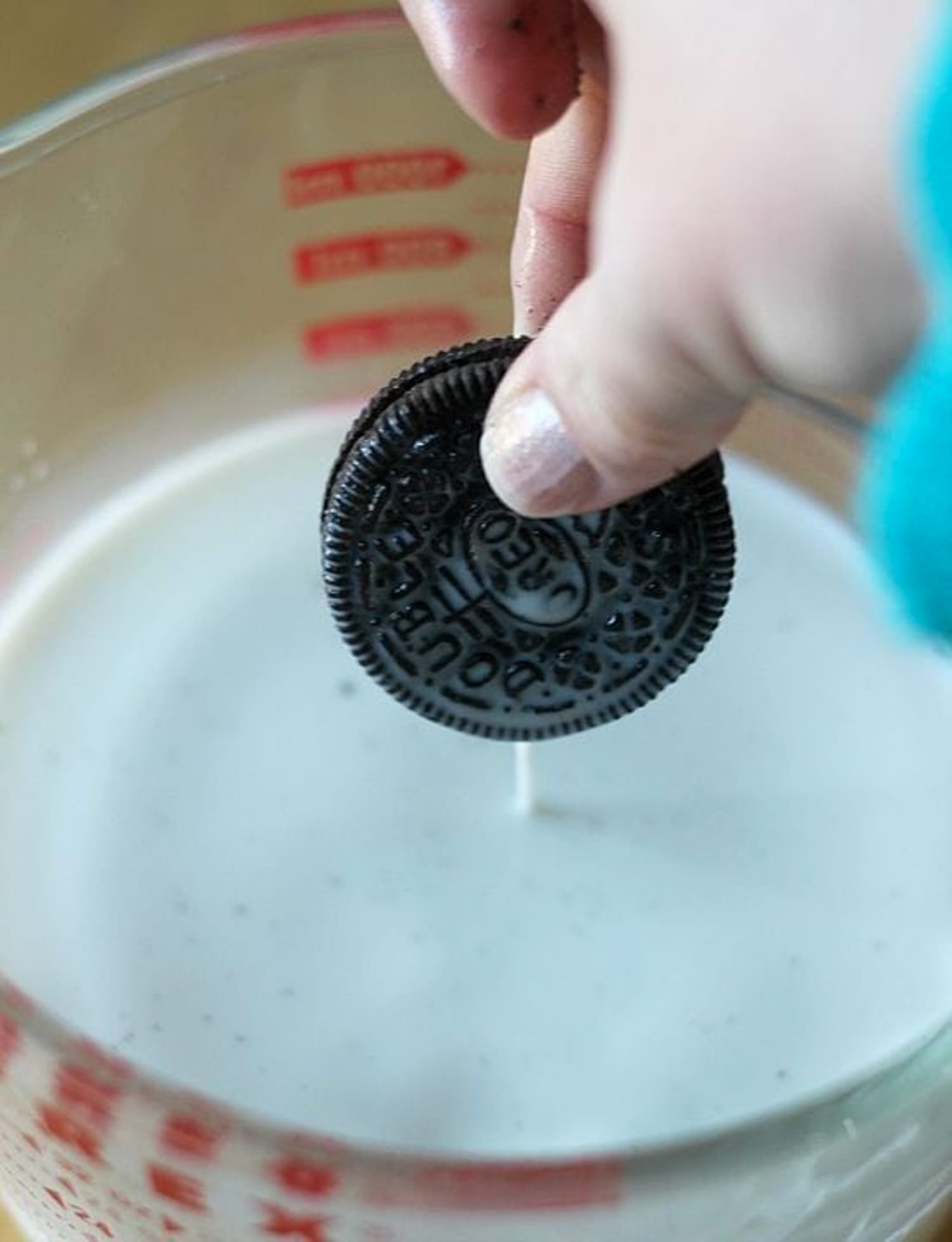 dipping an oreo into milk