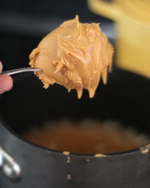 A heaping scoop of peanut butter on a spoon